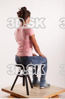 Sitting pose blue jeans pink t shirt of Oxana …